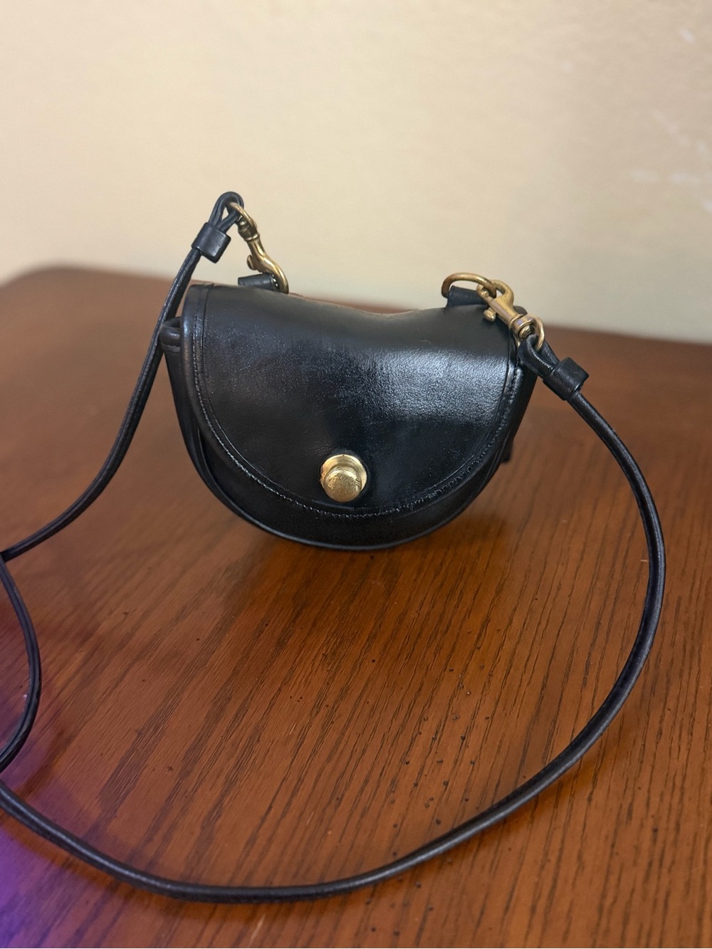 Black Leather Half-Moon Crossbody Bag with Gold Hardware